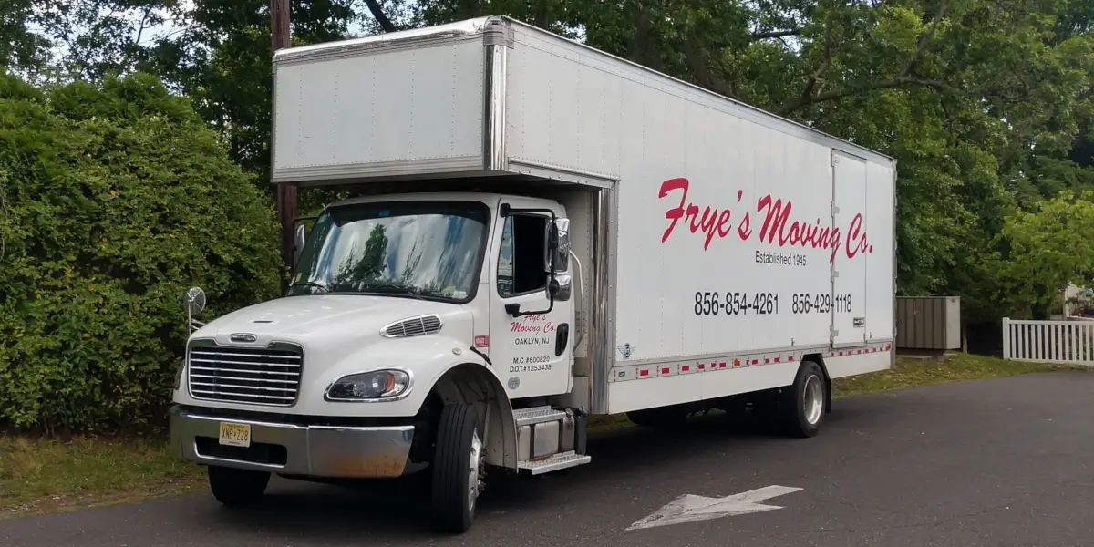 Frye's Moving Co. truck parked on a suburban road.