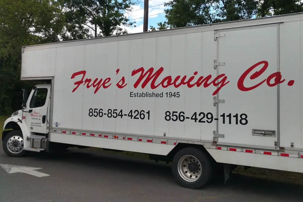 Frye's Moving Company truck parked on roadside.