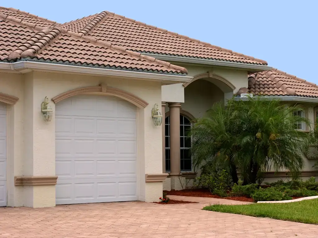 Florida Home Florida home with garage, palm trees and Spanish-barrel style tiles.