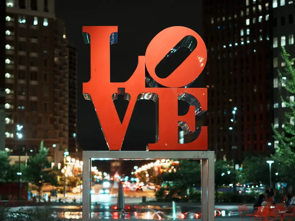 LOVE Love Park sign at night in the business district area of Philadelphia, Pennsylvania.