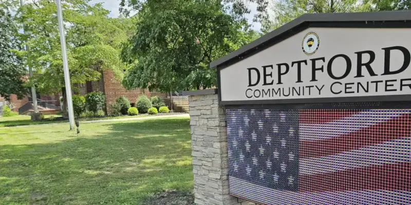 Deptford Community Center sign with digital screen below of U.S.A. flag.