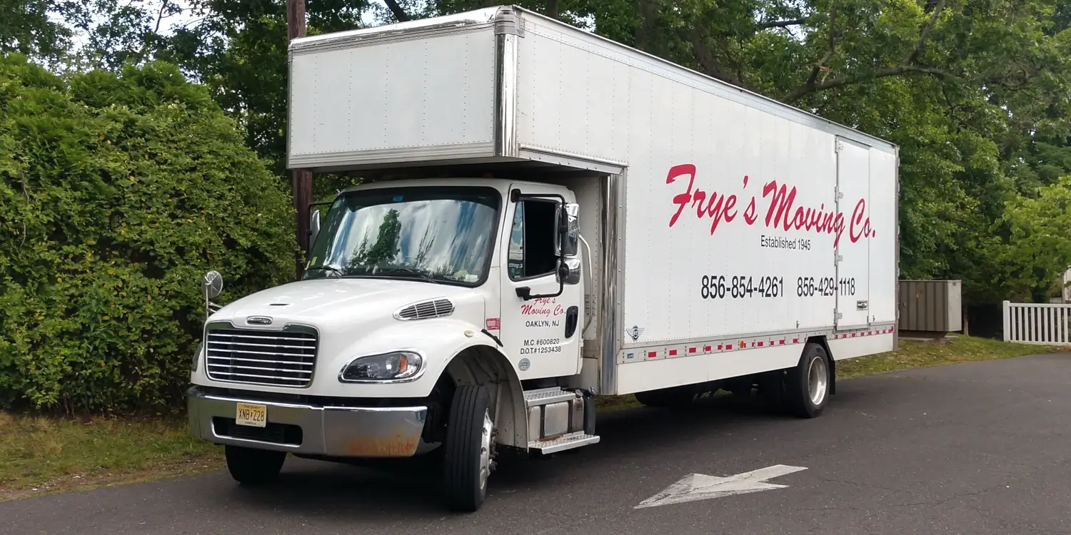 Frye's Moving Company truck parked on suburban street.