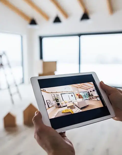Person viewing home interior design on tablet.