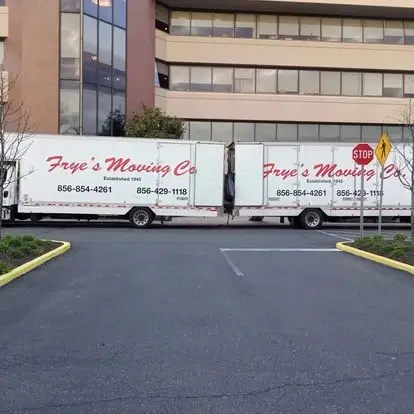 Frye's Moving Company trucks parked in front of a hospital moving out medical equipment.