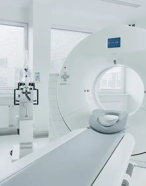 Modern hospital MRI machine in a clean white room.