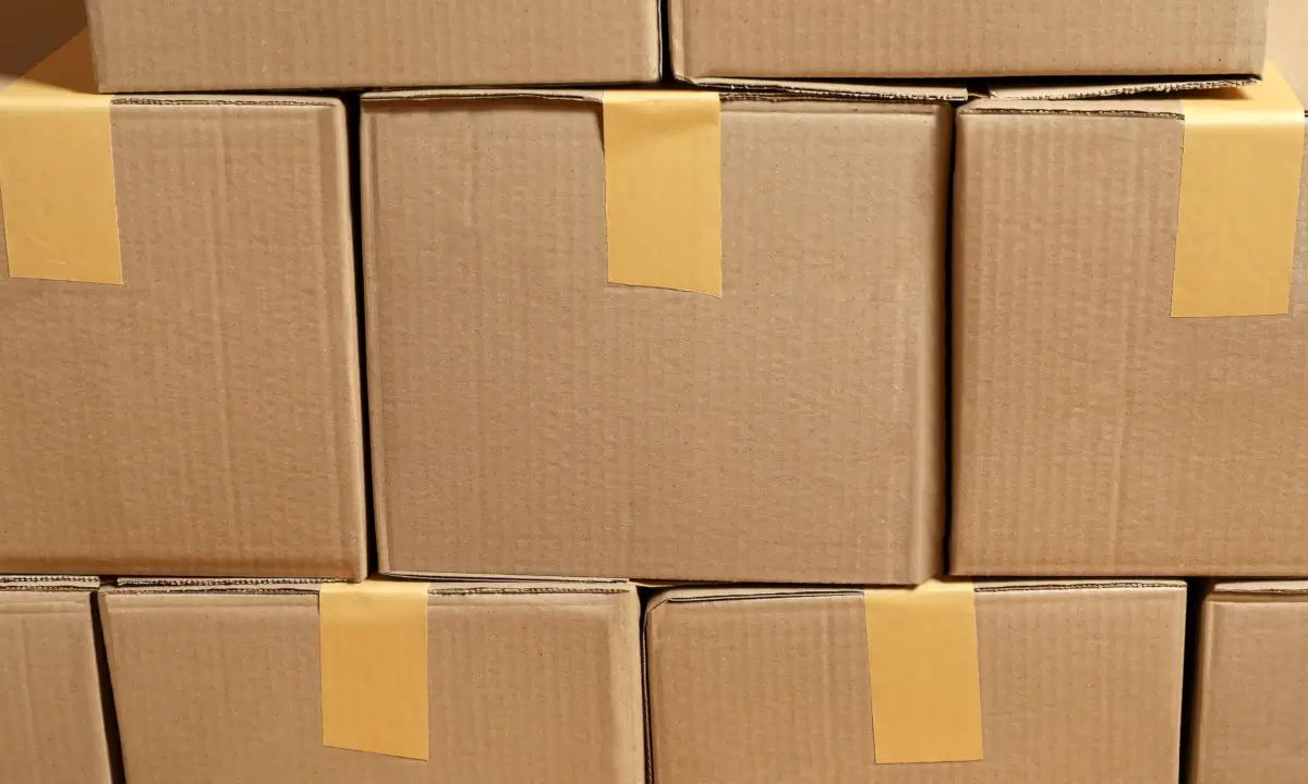 Stacked cardboard boxes sealed with tape.